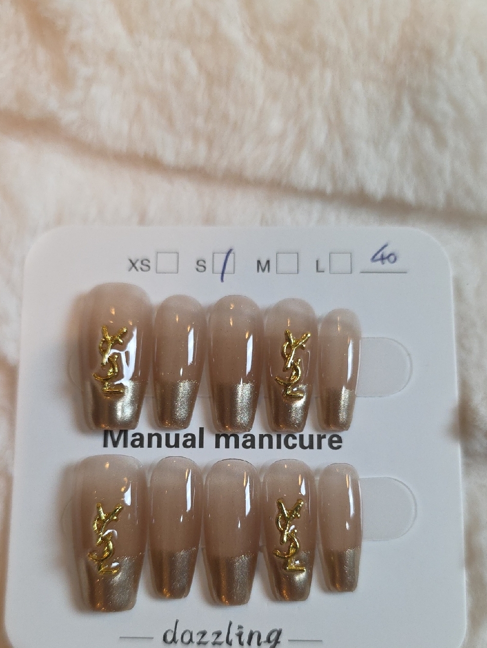 Neutral Nude Press-On Nails with Gold Accent Logo